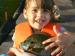 photo of child holding fish