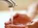 photo of hands held under running water tap