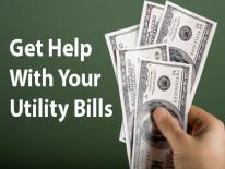 Image of hand holding cash. Get Help With Your Utility Bill