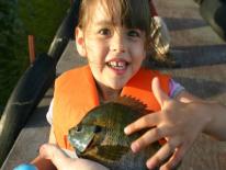 Photo of child holding fish