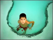photo of boy in swimming pool