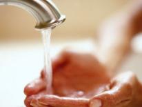 Photo of washing hands in sink